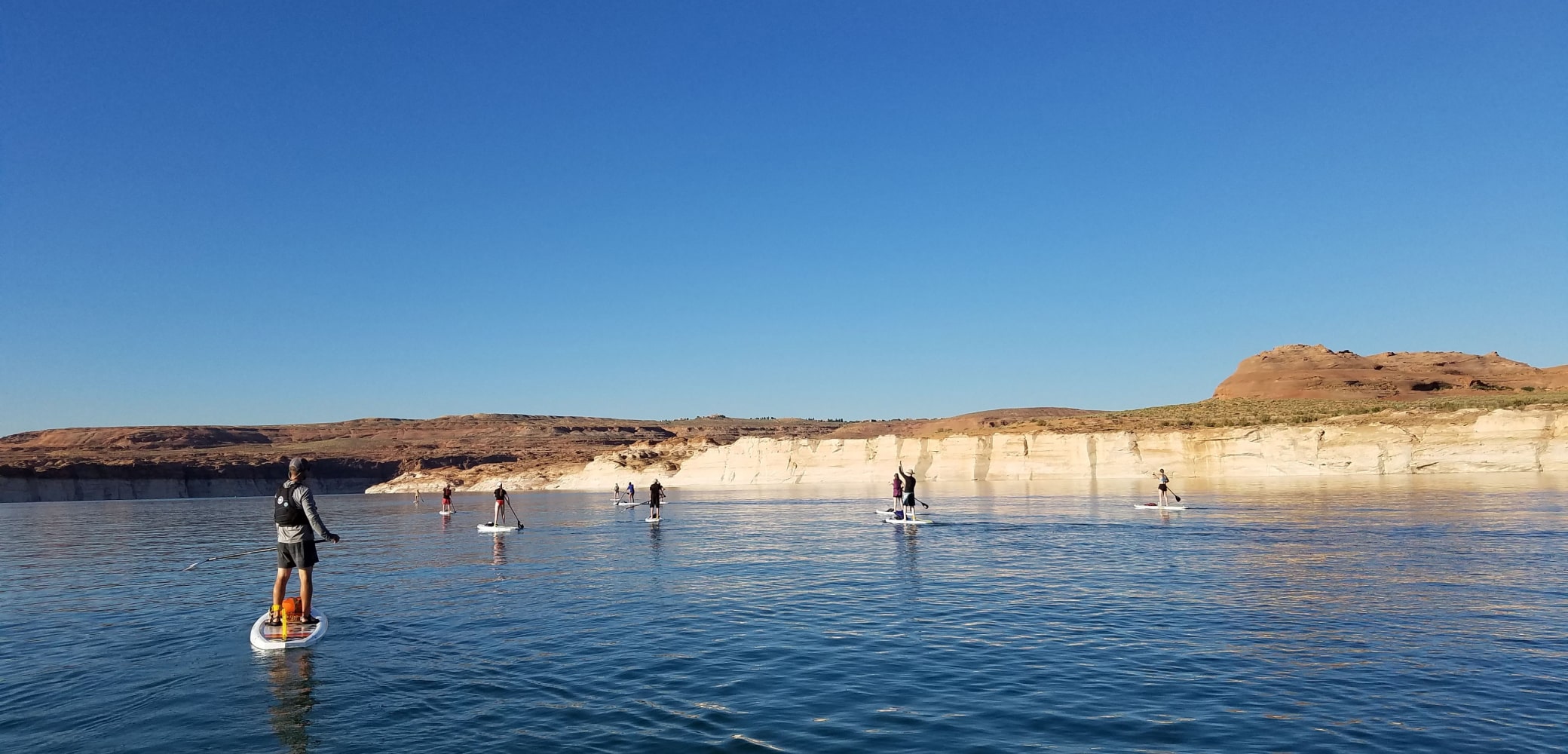 group stand up paddleboarding lake powell