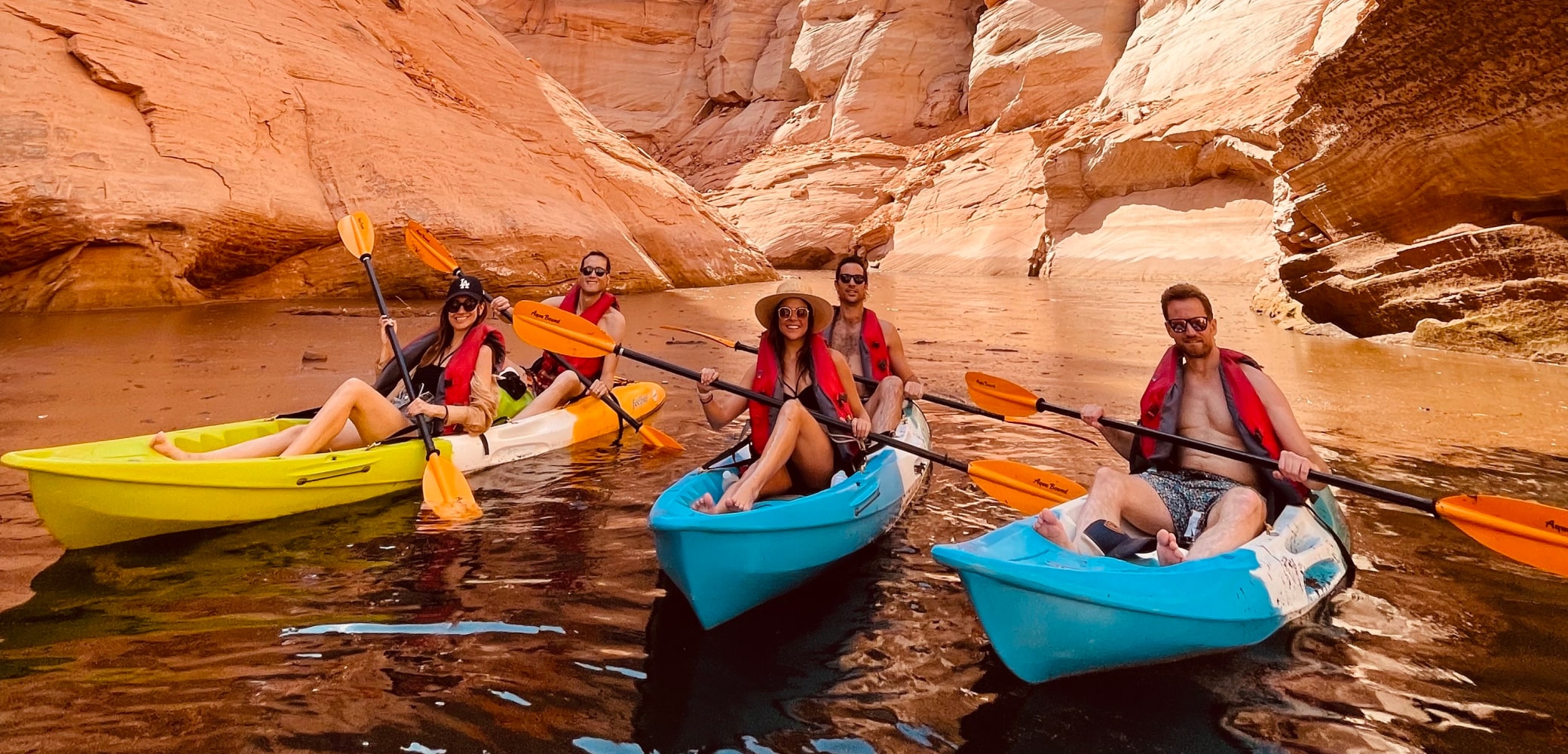 group of kayakers at the beginning of a canyon on lake powell on a guided tour