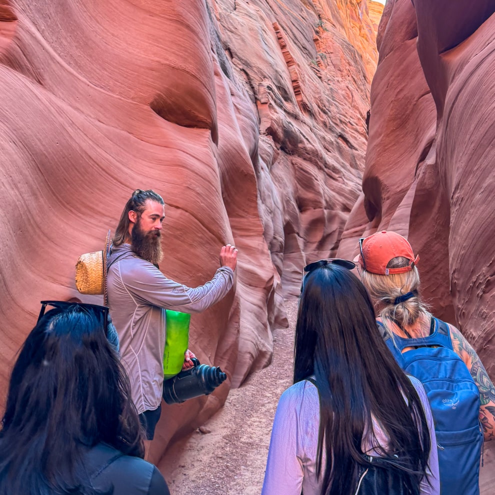 group hiking through antelope canyon