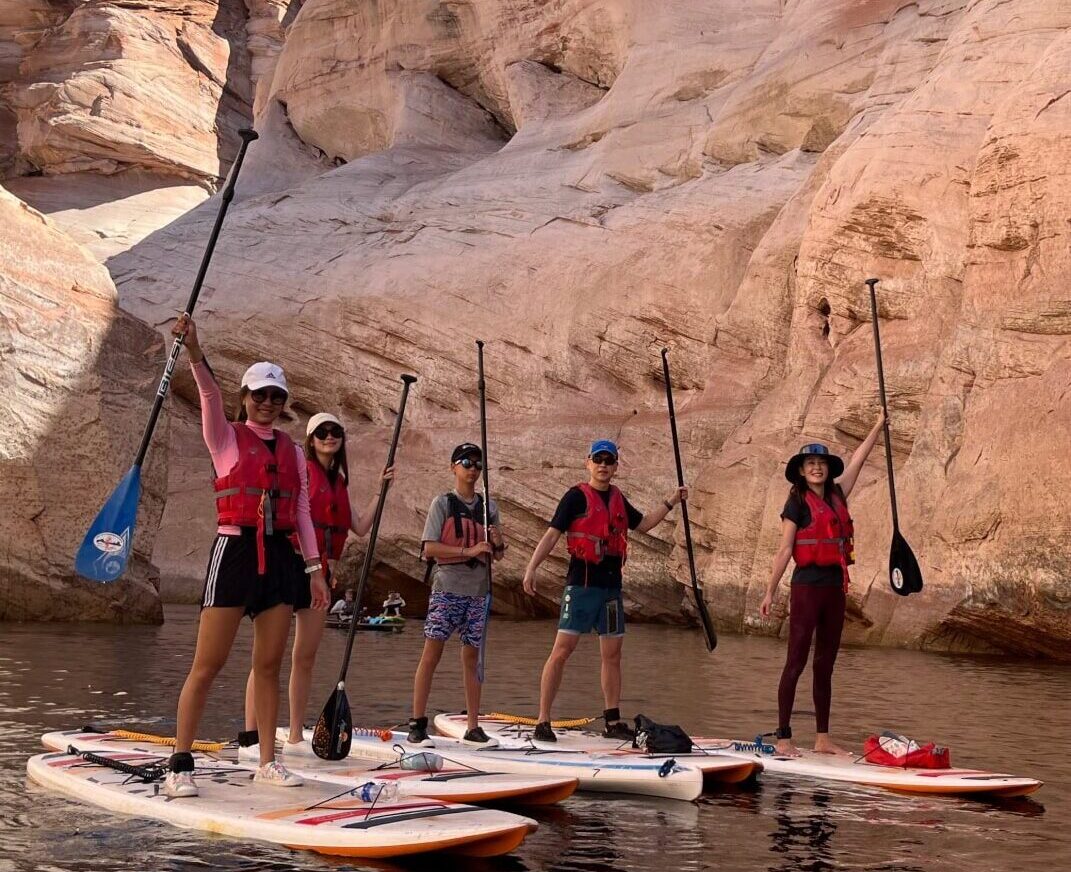 group on guided paddleboard tour through antelope canyon