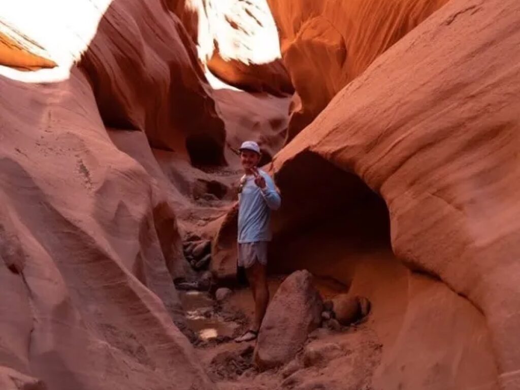 one of the lake powell paddleboards and kayaks guides, austin, in a slot canyon