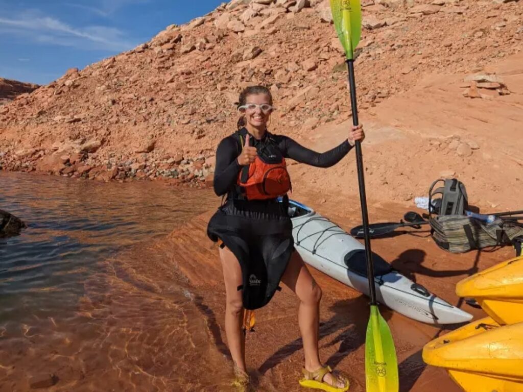 one of the lake powell paddleboards and kayaks guides, kenna taking a break from paddling a kayak