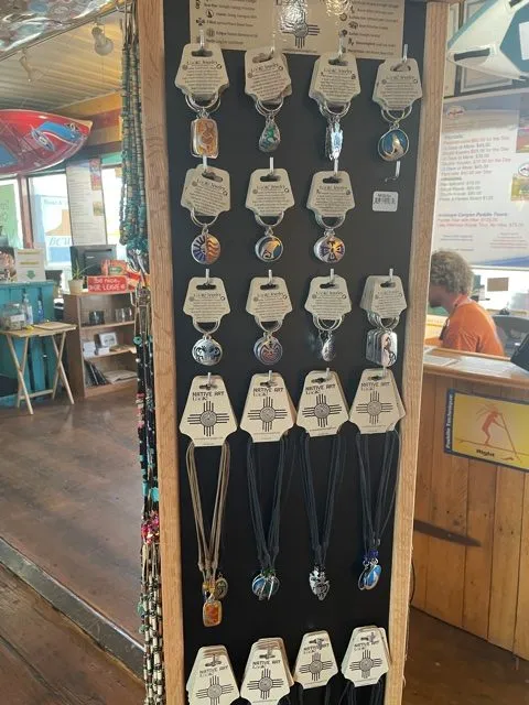 lake powell souvenirs such as keychains and necklaces in the lake powell paddleboard and kayak gift shop