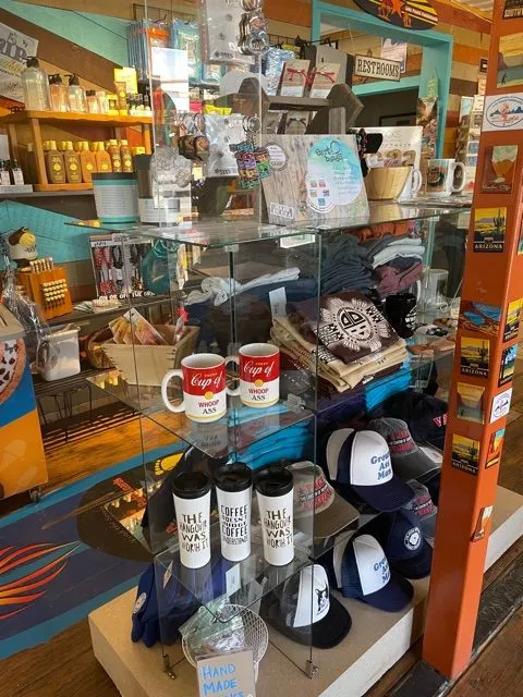 lake powell souvenirs such as mugs and hats in the lake powell paddleboard and kayak gift shop