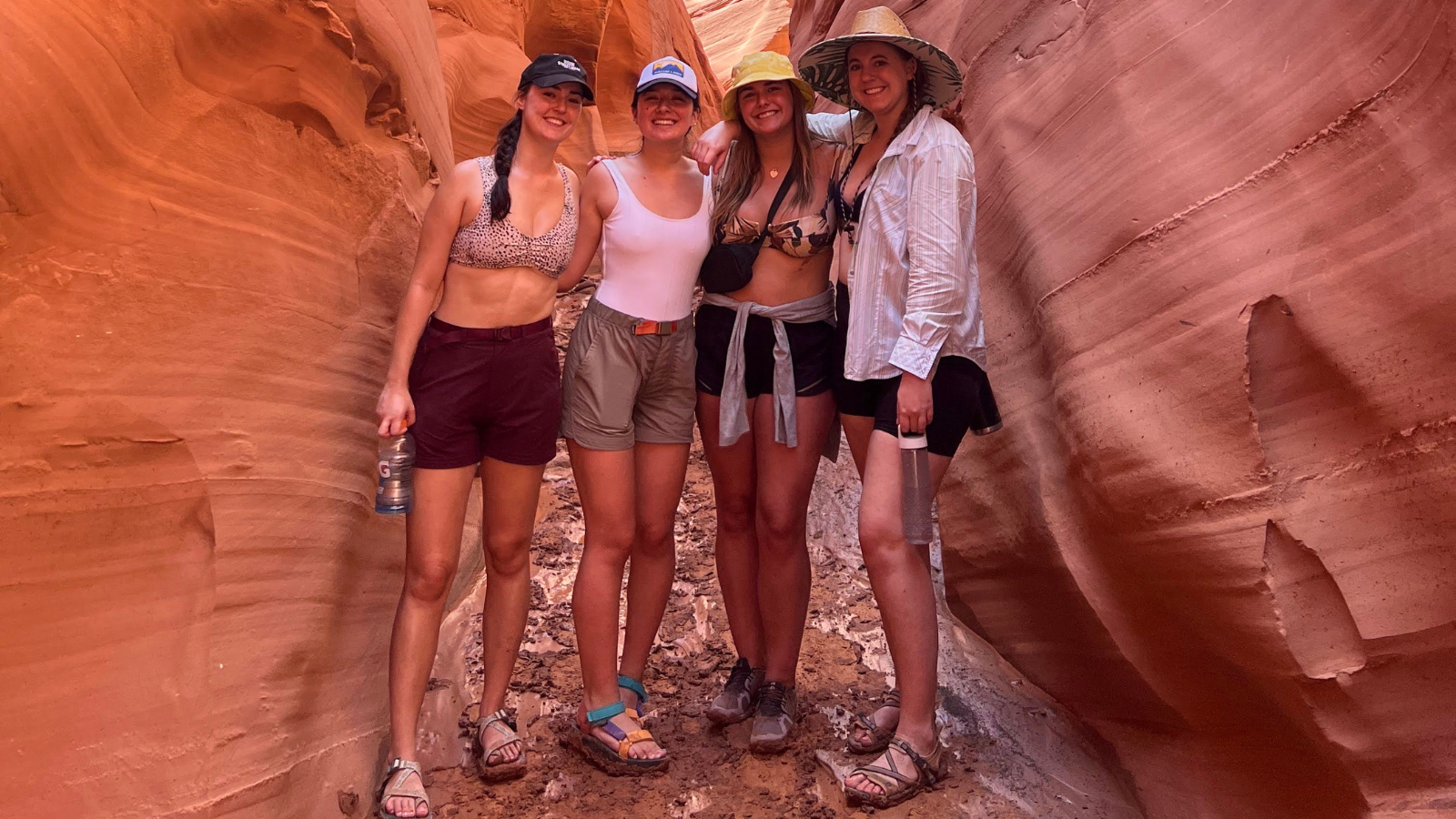 four women pose for a photo in the summer heat in Page, Arizona
